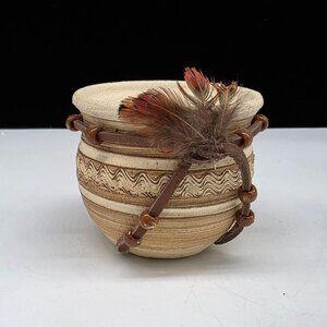 Handcrafted Ceramic Decorative Vessel With Leather Straps & Feather Accent